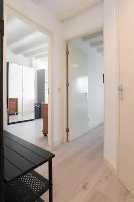 a room with a mirror and a black table at Central Rooftop Terrace Guest Suite in Amsterdam