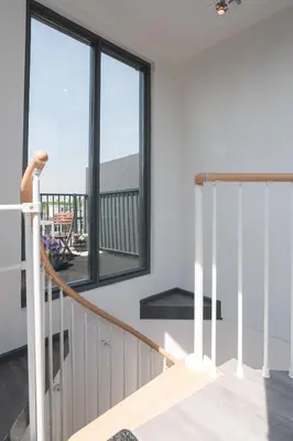 a staircase in a house with a window at Central Rooftop Terrace Guest Suite in Amsterdam