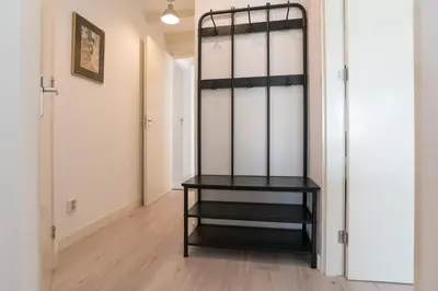 a room with a black shelf in a room at Central Rooftop Terrace Guest Suite in Amsterdam
