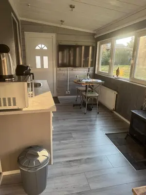 a kitchen and dining room with a table and chairs at Carpe Diem in Zandvoort