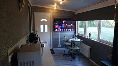 a small kitchen with a table in a tiny house at Carpe Diem in Zandvoort