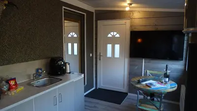 a kitchen with a sink and a counter top at Carpe Diem in Zandvoort