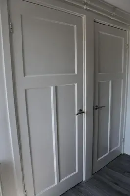a room with two sliding doors in a room at Sleep Inn Amsterdam in Amsterdam