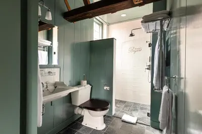 a bathroom with a toilet and a sink and a shower at Hotel Beijers in Utrecht