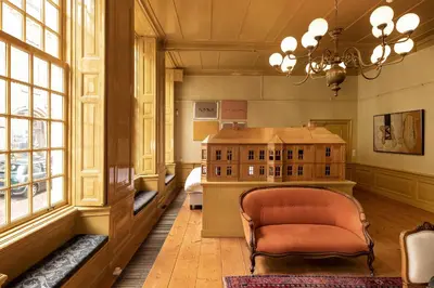 a room with a chair and a model of a building at Hotel Beijers in Utrecht