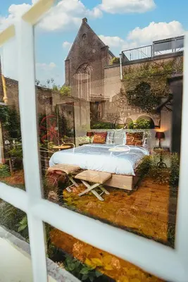 a view of a bedroom from a window at Hotel Beijers in Utrecht