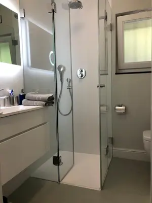 a glass shower in a bathroom with a sink at Modern Palace Emma Staete in Baarn
