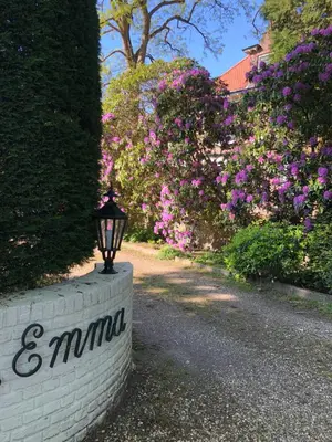 a brick wall with a street light on it at Modern Palace Emma Staete in Baarn