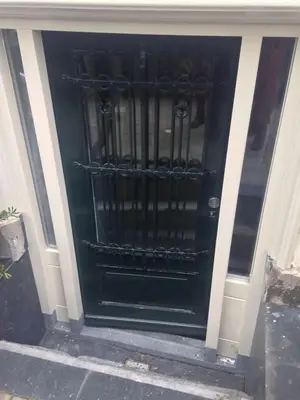 a black front door of a building at Quiet apartment for 4 at park in center in Amsterdam