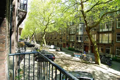 a view from a balcony of a street with buildings at Wooden Mill B&B in Amsterdam