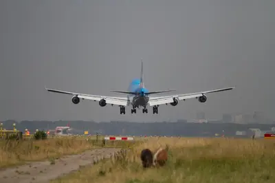 an airplane is taking off from an airport runway at Bastion Hotel Amsterdam Airport in Hoofddorp