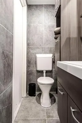 a bathroom with a toilet and a sink at Studio Pit-Stop in Zandvoort
