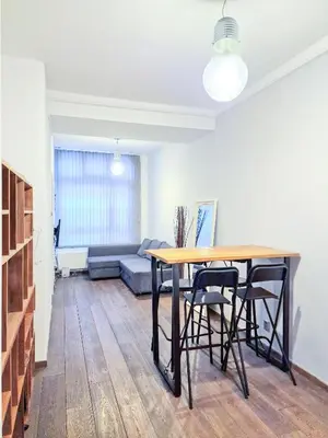 a living room with a table and chairs and a couch at A cozy place in Amsterdam in Amsterdam