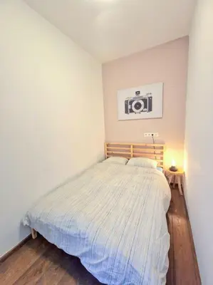 a bedroom with a bed in a white room at A cozy place in Amsterdam in Amsterdam