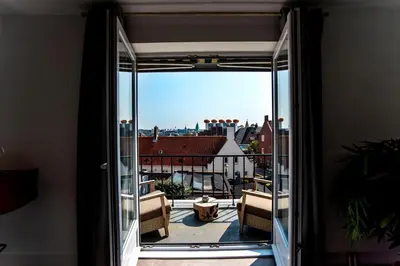 a balcony with a view of the city from a room at Bamboa Beachhouse in Zandvoort