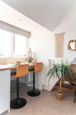 a dining room with a table and two chairs at Bamboa Beachhouse in Zandvoort