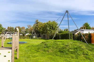 an empty playground in a yard at Ferienhaus Weitblick in Sint Maarten