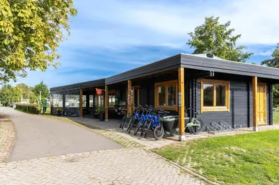 a black building with bikes parked outside of it at Ferienhaus Weitblick in Sint Maarten