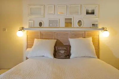 a bedroom with a bed with two white pillows at Studio Sautille in Zandvoort
