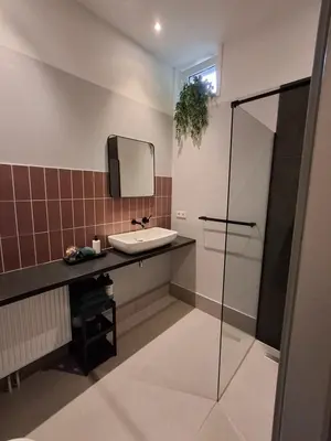 a bathroom with a sink and a mirror at Inn the Green in Zeist