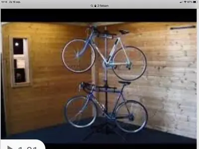 two bikes on a bike rack on a wall at Design BB Bed&Bike holiday cottage Tiny Home in Spakenburg in Spakenburg