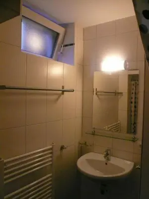 a bathroom with a sink and a mirror at Houseboat Vliegenbos in Amsterdam