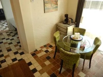 a dining room with a glass table and chairs at Apartment Amsterdam New West - Free parking in Amsterdam