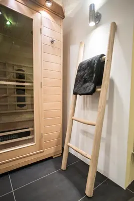 a wooden ladder in a kitchen next to a oven at Amsterdam House of Arts & Crafts in Amsterdam