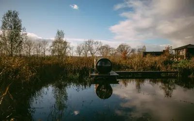 a body of water with a sculpture in the middle at Basecamp Amsterdam in Amsterdam