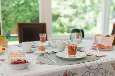 a table with plates of food and drinks on it at Bed and Breakfast Hoorn in Hoorn