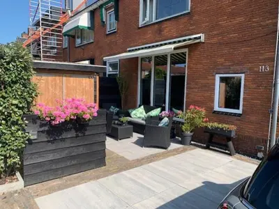 a patio in front of a brick building at Sunny Place in Zandvoort
