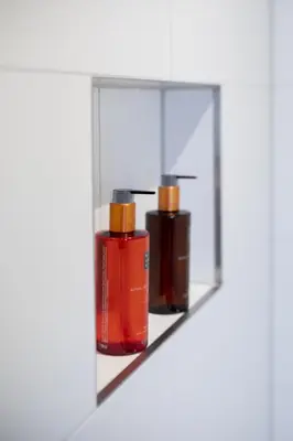 a group of three bottles on a shelf at Saenliefde in Wormer