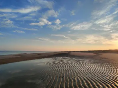 a view of a beach with ripples in the sand at B&B Be Our Guest in Sint Maarten