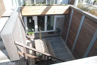 an outside view of a house with a wooden door at Luxury Beach Studio Zandvoort in Zandvoort