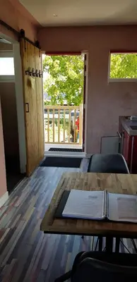 a room with a table with a book on it at Jabaki Red Studio in Hoofddorp