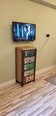 a flat screen tv sitting on top of a wall at JaBaKi Green Studio in Hoofddorp