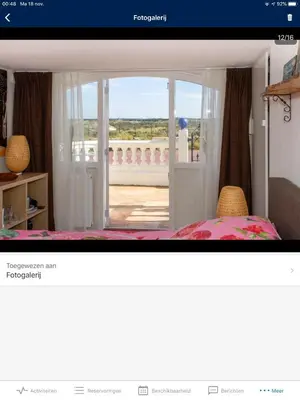 a room with a door open to a balcony at little ibiza in Zandvoort
