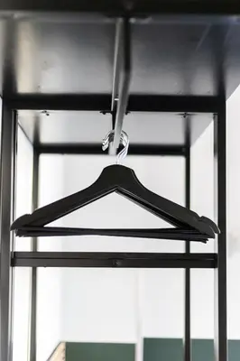 a black hanger hanging in front of a window at Weber Hotel 117 in Amsterdam