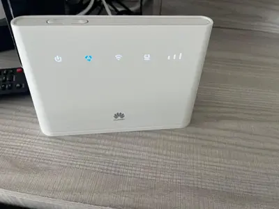 a white laptop computer sitting on top of a bed at Luxe Chalet op camping Duindoorn, IJmuiden aan Zee, in de buurt van F1 circuit Zandvoort en Bloemendaal op loopafstand strand in IJmuiden