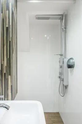 a bathroom with a shower with a toilet and a sink at Villa Monte Dana in Zwanenburg