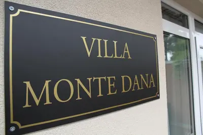 a sign for a monte davis movie channel at Villa Monte Dana in Zwanenburg