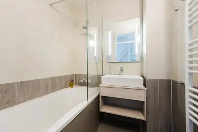 a bathroom with a sink and a glass shower at Center Parcs Zandvoort beach in Zandvoort