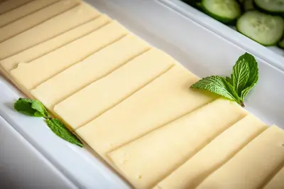 a container of cheese with mint on top at Amsterdam Hotelboat in Amsterdam