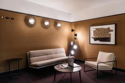 a living room with a couch and a chair and a table at The Hunfeld in Utrecht