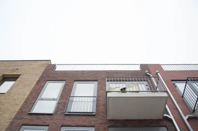 an apartment building looking up at the sky at B&B Mondriaan in Amsterdam