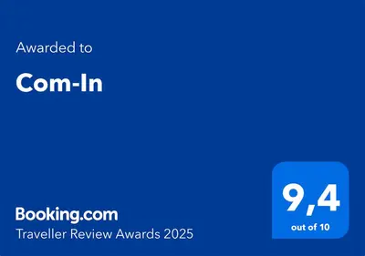 a blue screen with the textrated to corninin travelling review awards at Com-In in Alkmaar