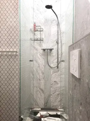 a shower with a glass door in a bathroom at BB in Amsterdam, 35m2, gratis parkeren in Amsterdam