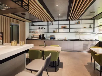 a dining room with a table and chairs at Executive Residency by Best Western Amsterdam Airport in Hoofddorp