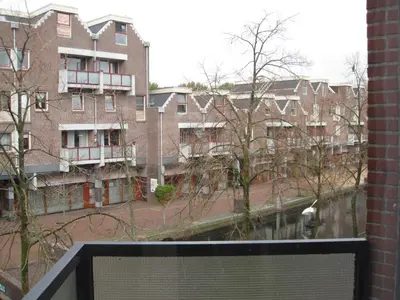 a view of an apartment building from a window at Bed & Ontbijt Haddock in Almere