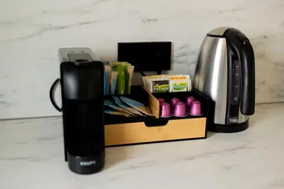 a coffee maker and a coffeemaker on a counter at Grand Central Suites in Zandvoort
